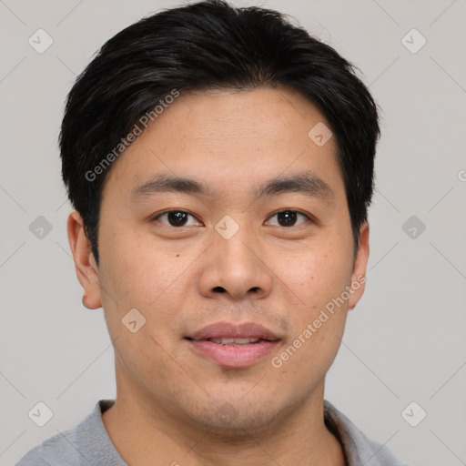 Joyful asian young-adult male with short  black hair and brown eyes