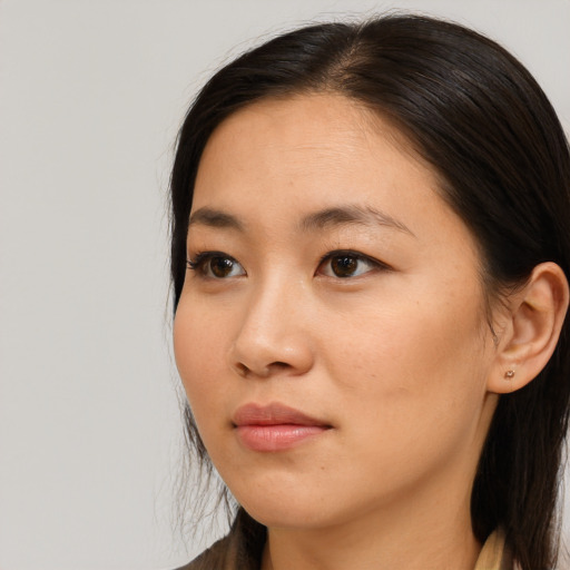 Neutral asian young-adult female with long  brown hair and brown eyes