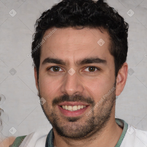 Joyful white young-adult male with short  black hair and brown eyes