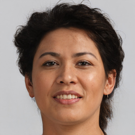 Joyful asian adult female with medium  brown hair and brown eyes