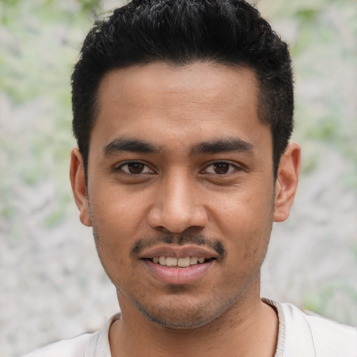 Joyful asian young-adult male with short  black hair and brown eyes