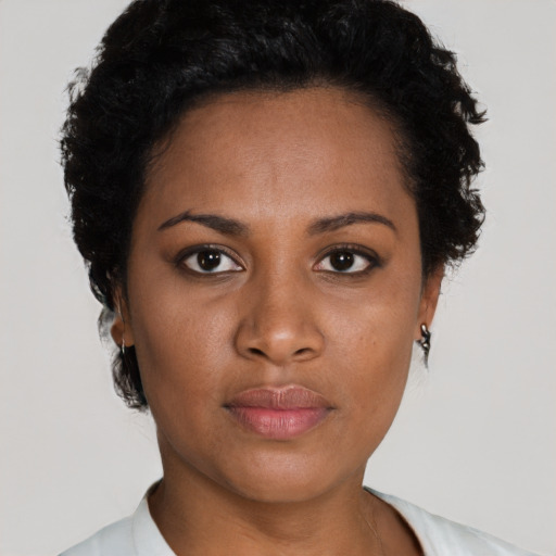 Neutral black young-adult female with short  black hair and brown eyes