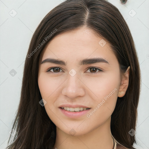 Joyful white young-adult female with long  brown hair and brown eyes