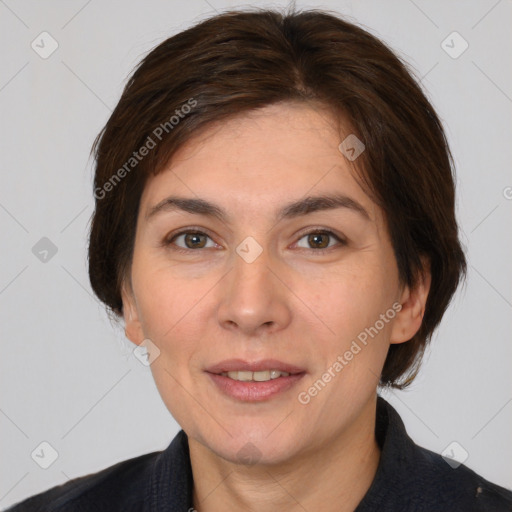 Joyful white adult female with medium  brown hair and brown eyes