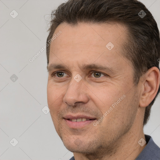 Joyful white adult male with short  brown hair and brown eyes