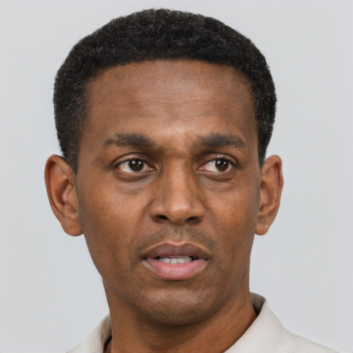 Neutral black adult male with short  black hair and brown eyes
