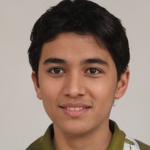 Joyful asian young-adult male with short  black hair and brown eyes