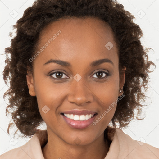 Joyful black young-adult female with long  brown hair and brown eyes