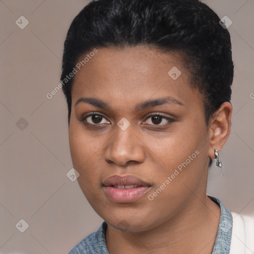 Joyful black young-adult female with short  black hair and brown eyes