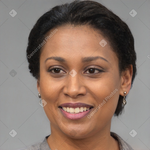 Joyful latino adult female with short  brown hair and brown eyes