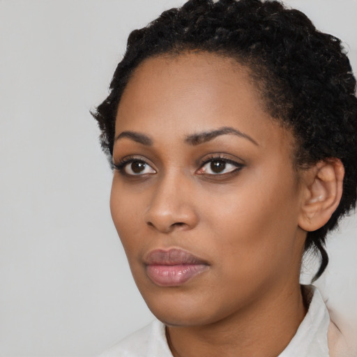 Neutral black young-adult female with short  black hair and brown eyes