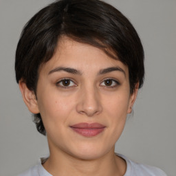 Joyful white young-adult female with medium  brown hair and brown eyes