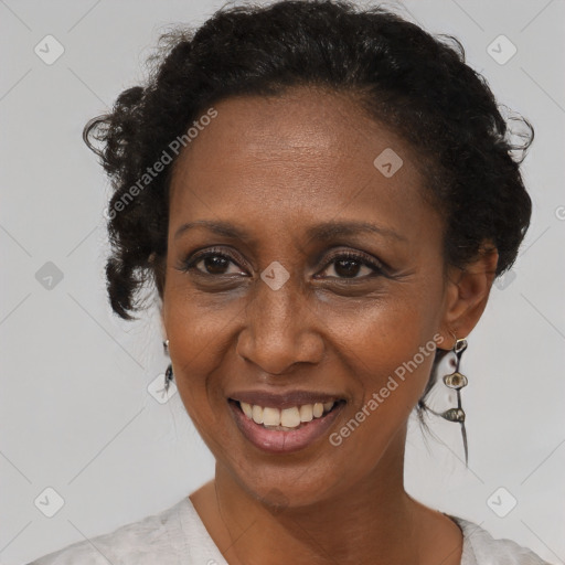 Joyful black adult female with short  brown hair and brown eyes