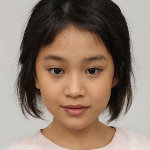 Joyful asian child female with medium  brown hair and brown eyes