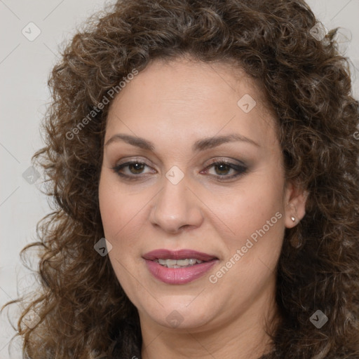 Joyful white adult female with long  brown hair and brown eyes