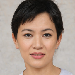 Joyful asian young-adult female with short  brown hair and brown eyes