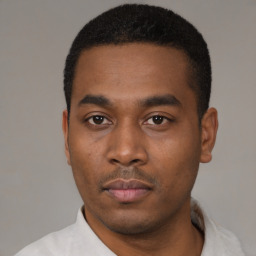 Neutral black young-adult male with short  black hair and brown eyes