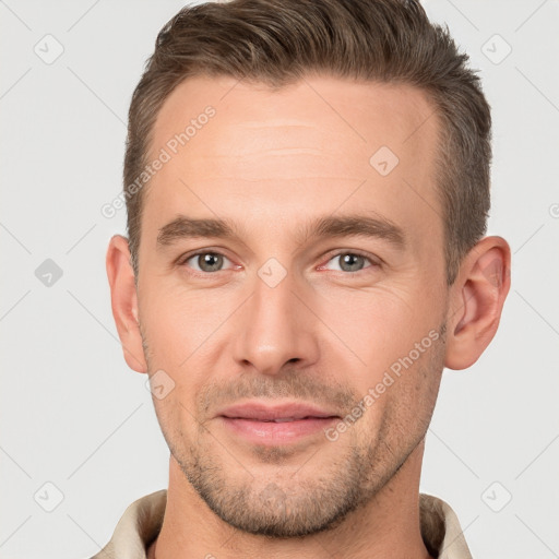 Joyful white young-adult male with short  brown hair and brown eyes