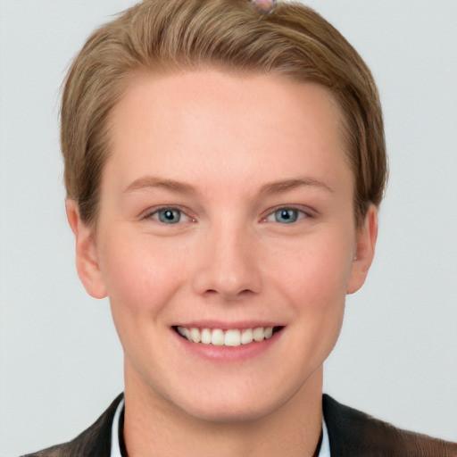 Joyful white young-adult female with short  brown hair and grey eyes