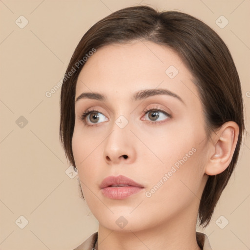 Neutral white young-adult female with medium  brown hair and brown eyes