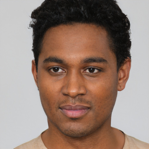 Neutral black young-adult male with short  black hair and brown eyes