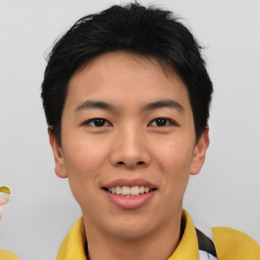 Joyful asian young-adult male with short  brown hair and brown eyes