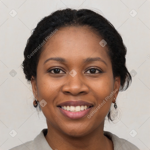 Joyful black young-adult female with medium  black hair and brown eyes