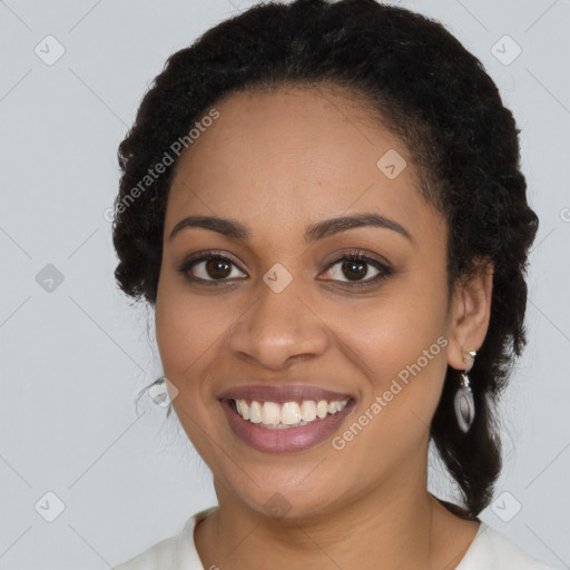 Joyful latino young-adult female with long  black hair and brown eyes