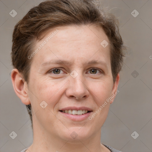 Joyful white adult female with short  brown hair and grey eyes