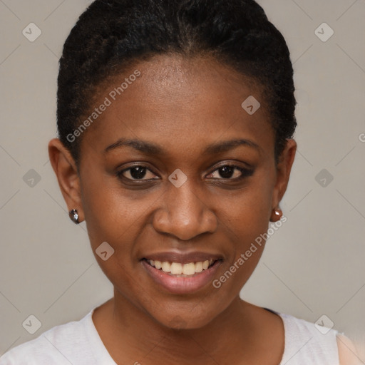 Joyful black young-adult female with short  black hair and brown eyes