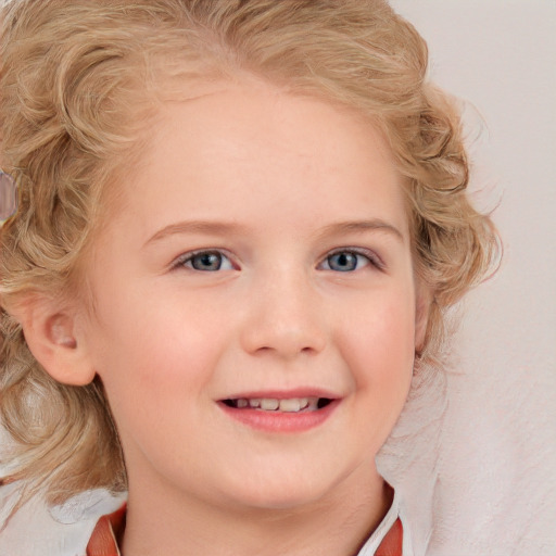 Joyful white child female with medium  blond hair and blue eyes