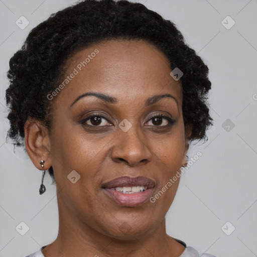 Joyful black adult female with short  brown hair and brown eyes