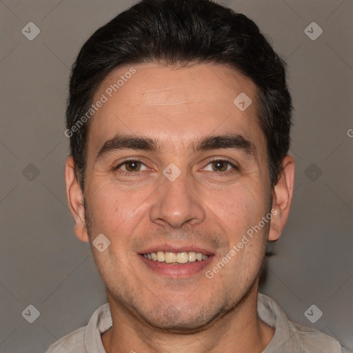 Joyful white adult male with short  brown hair and brown eyes