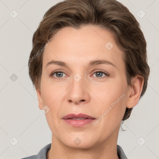 Joyful white adult female with short  brown hair and grey eyes