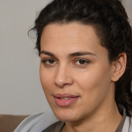 Joyful white young-adult female with medium  brown hair and brown eyes