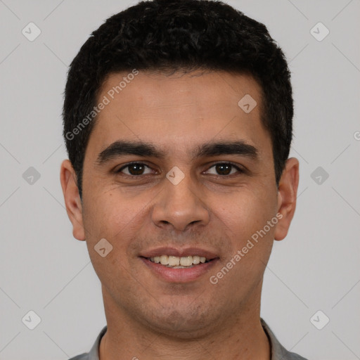 Joyful white young-adult male with short  black hair and brown eyes