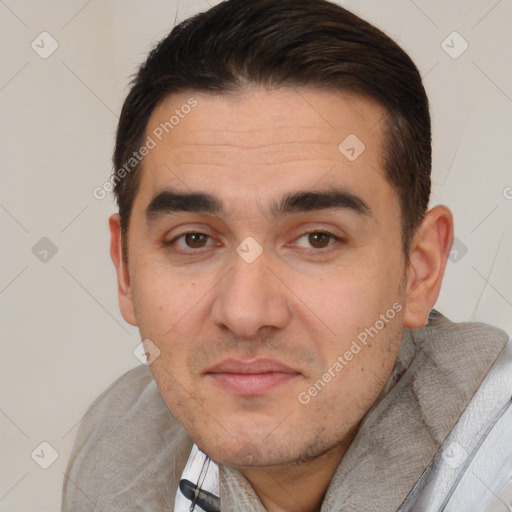 Joyful white adult male with short  brown hair and brown eyes