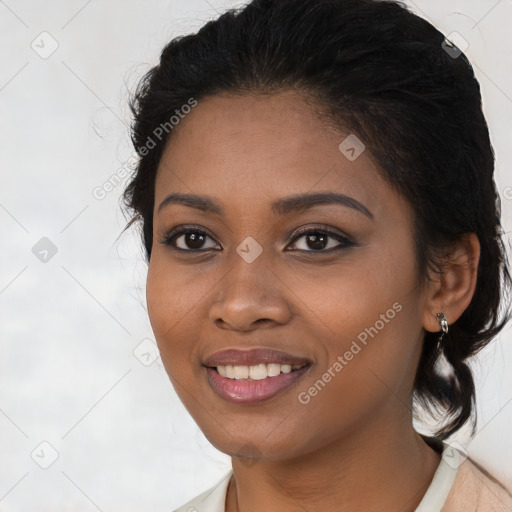 Joyful black young-adult female with medium  brown hair and brown eyes