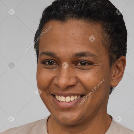 Joyful latino young-adult male with short  brown hair and brown eyes