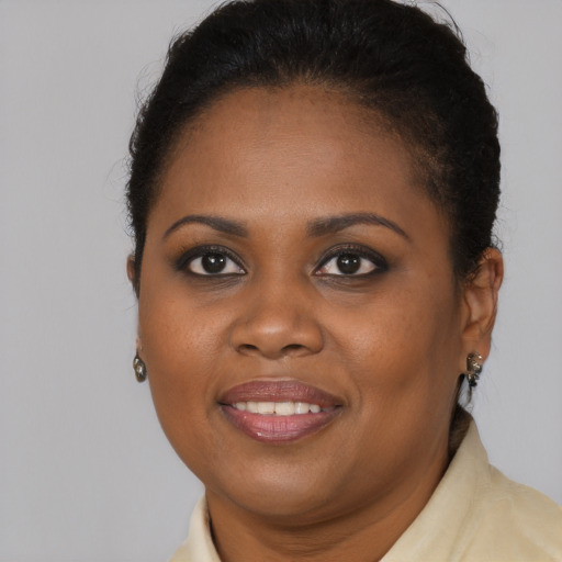 Joyful black young-adult female with medium  brown hair and brown eyes