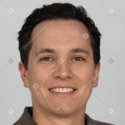 Joyful white adult male with short  brown hair and grey eyes