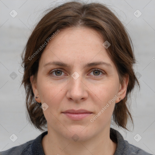 Joyful white adult female with medium  brown hair and grey eyes