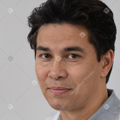 Joyful white adult male with short  black hair and brown eyes