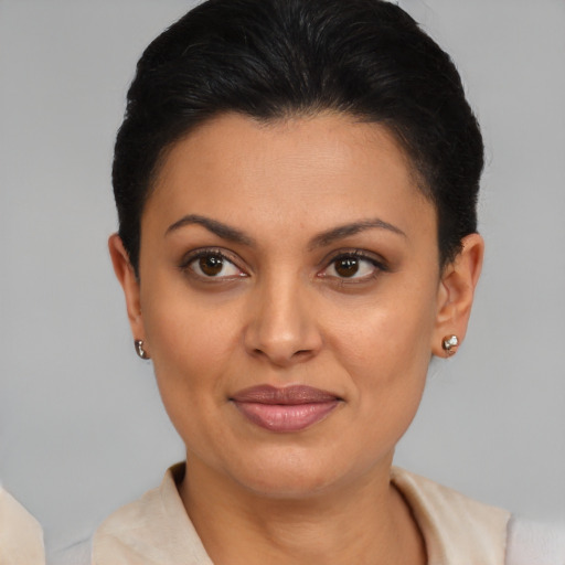 Joyful latino young-adult female with short  brown hair and brown eyes