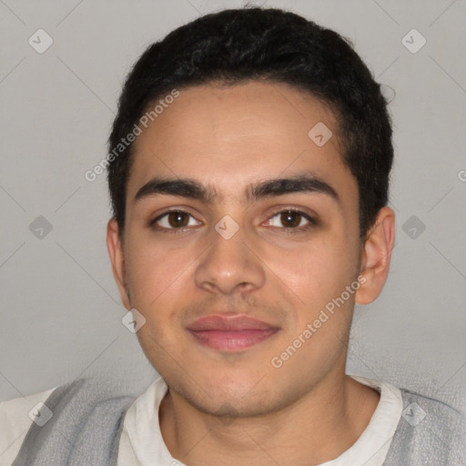 Joyful latino young-adult male with short  black hair and brown eyes