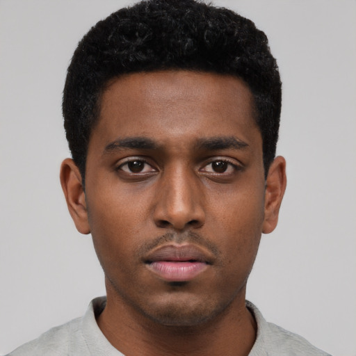 Neutral black young-adult male with short  black hair and brown eyes