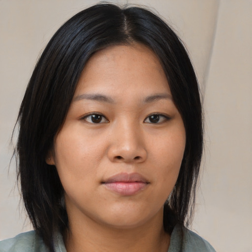 Neutral asian young-adult female with medium  brown hair and brown eyes