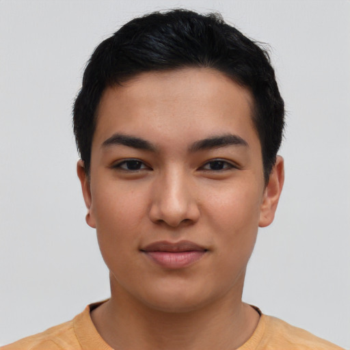 Joyful asian young-adult male with short  black hair and brown eyes