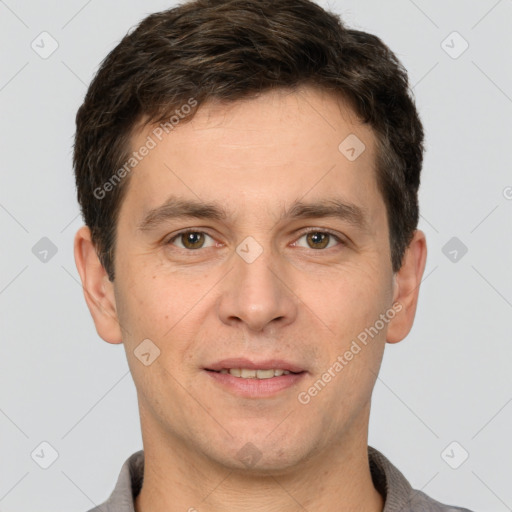 Joyful white adult male with short  brown hair and brown eyes