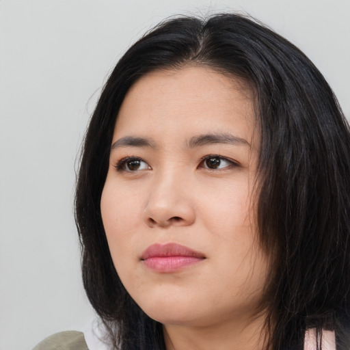 Joyful asian young-adult female with medium  black hair and brown eyes